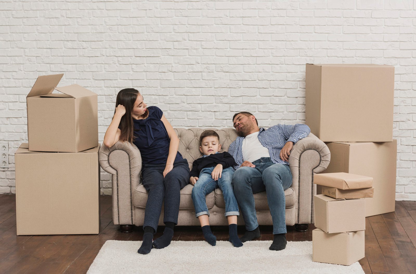 family-tired-after-packing-cardboard-boxes